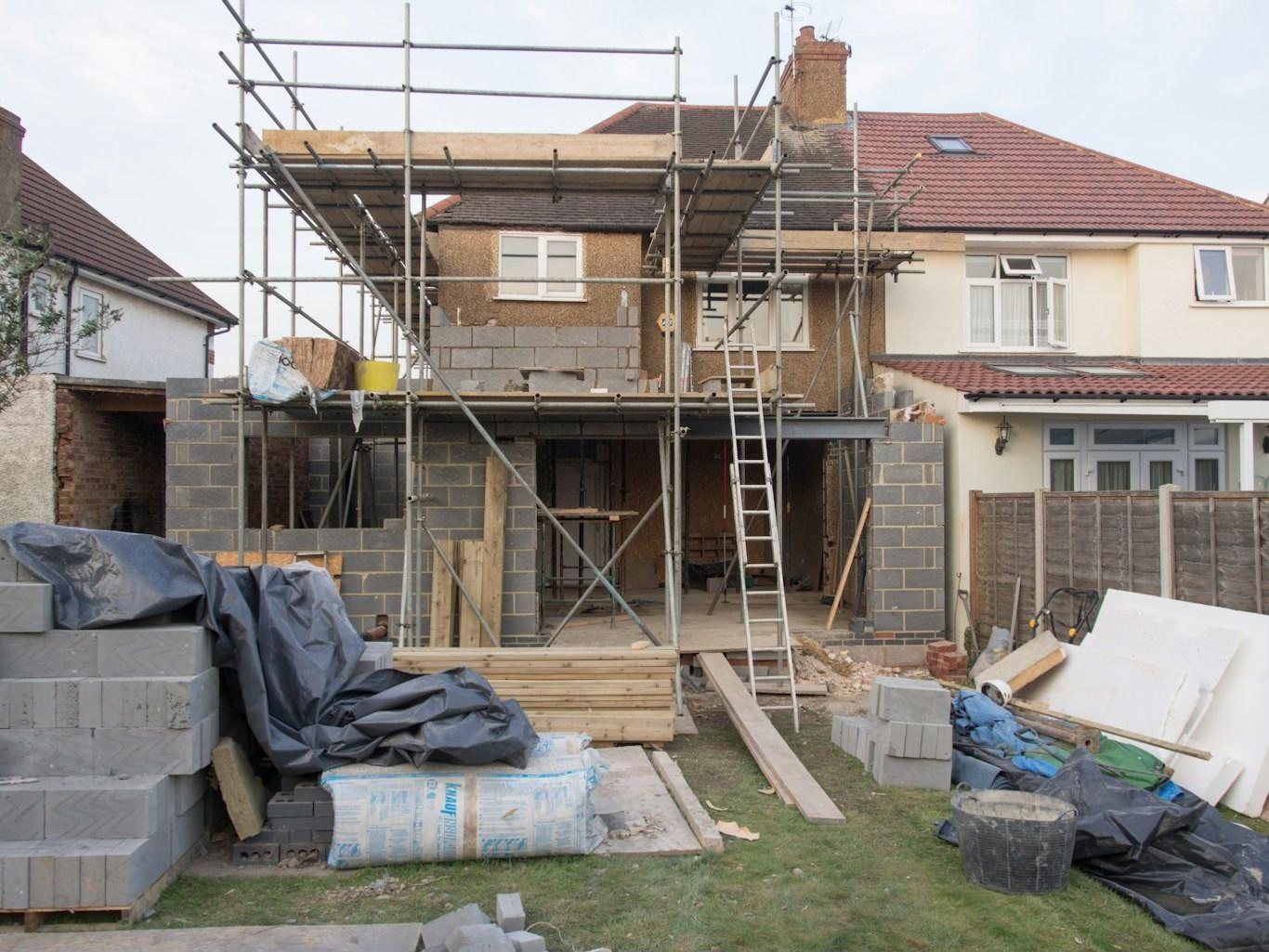 House extension under construction with new timber frame