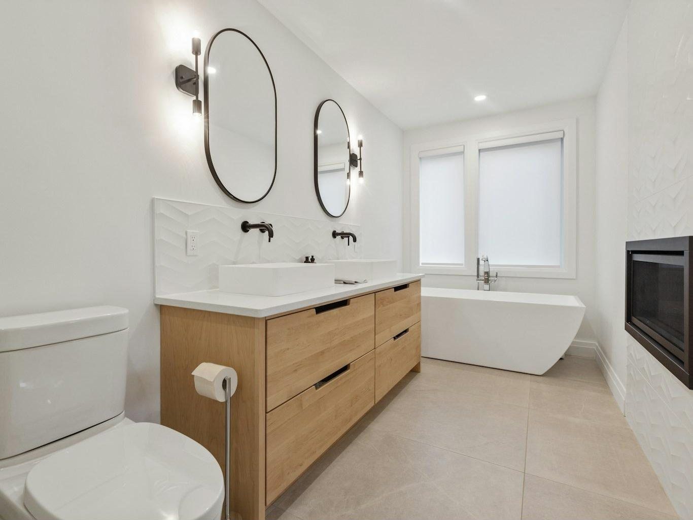 Newly renovated bathroom with walk-in shower and wall-hung vanity
